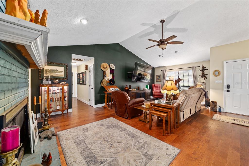 5030 Southeast 3rd Place Ocala, FL 34471 - Photo 11 of 45 a living room with furniture and a fireplace