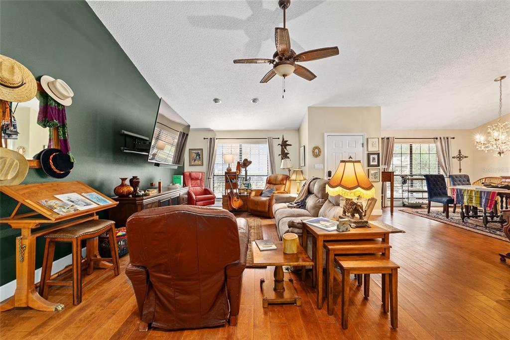 5030 Southeast 3rd Place Ocala, FL 34471 - Photo 12 of 45 a living room with lots of furniture and a flat screen tv