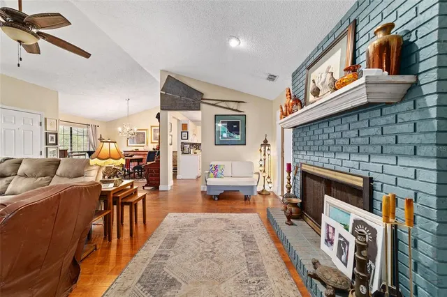 a living room with furniture flat screen tv and a fireplace