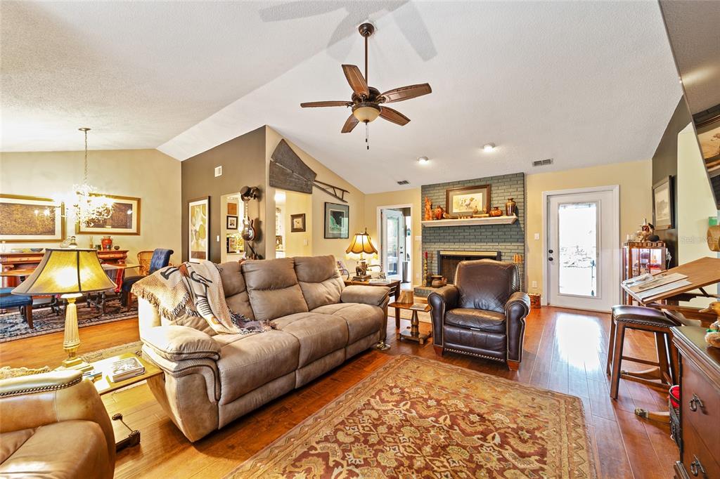 5030 Southeast 3rd Place Ocala, FL 34471 - Photo 18 of 45 a living room with furniture fireplace and a table