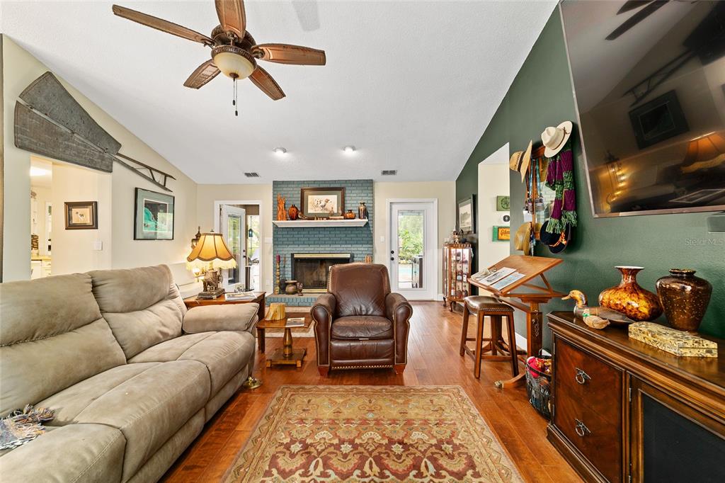 5030 Southeast 3rd Place Ocala, FL 34471 - Photo 19 of 45 a living room with furniture fireplace and a window