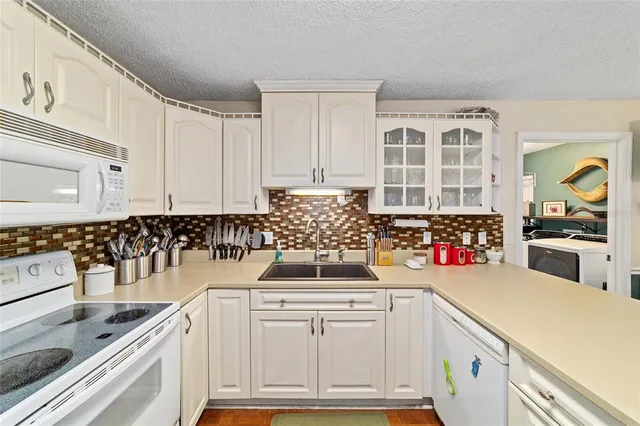 a kitchen with a sink and cabinets