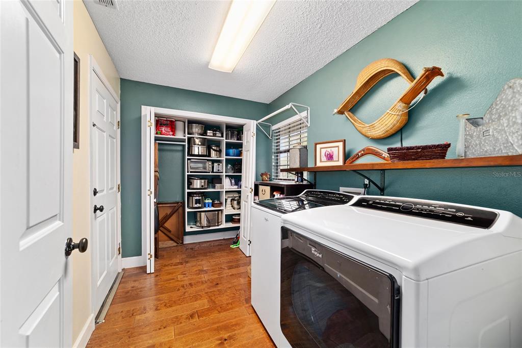 5030 Southeast 3rd Place Ocala, FL 34471 - Photo 27 of 45 a kitchen that has a lot of cabinets in it