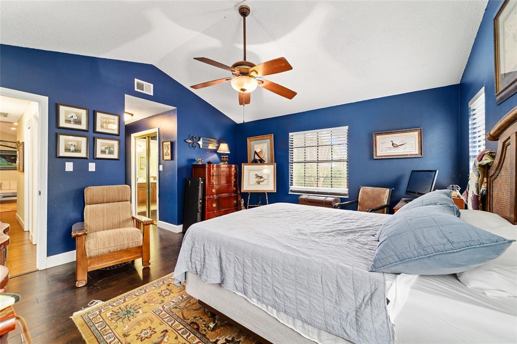 5030 Southeast 3rd Place Ocala, FL 34471 - Photo 29 of 45 a bedroom with a bed a couch and dresser