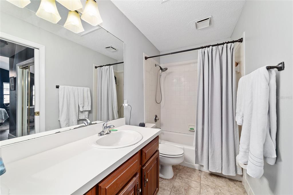 5030 Southeast 3rd Place Ocala, FL 34471 - Photo 33 of 45 a bathroom with a sink a toilet and shower