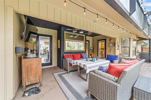 a living room with furniture a window and kitchen view
