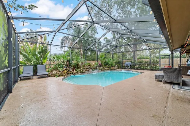 a view of a swimming pool with a patio