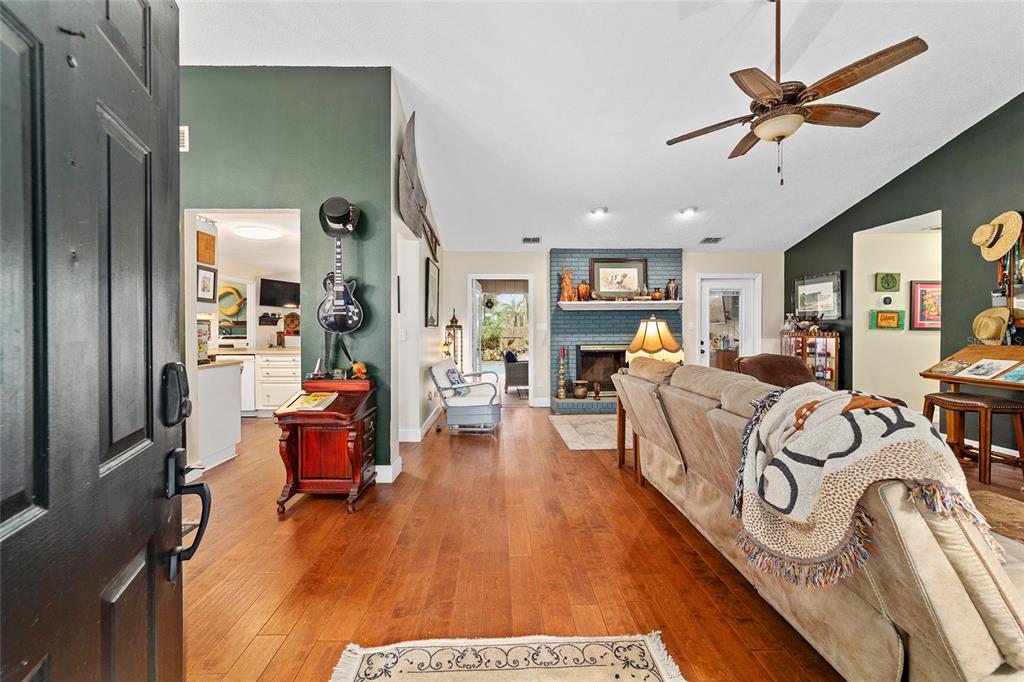 5030 Southeast 3rd Place Ocala, FL 34471 - Photo 5 of 45 a living room with furniture and a wooden floor