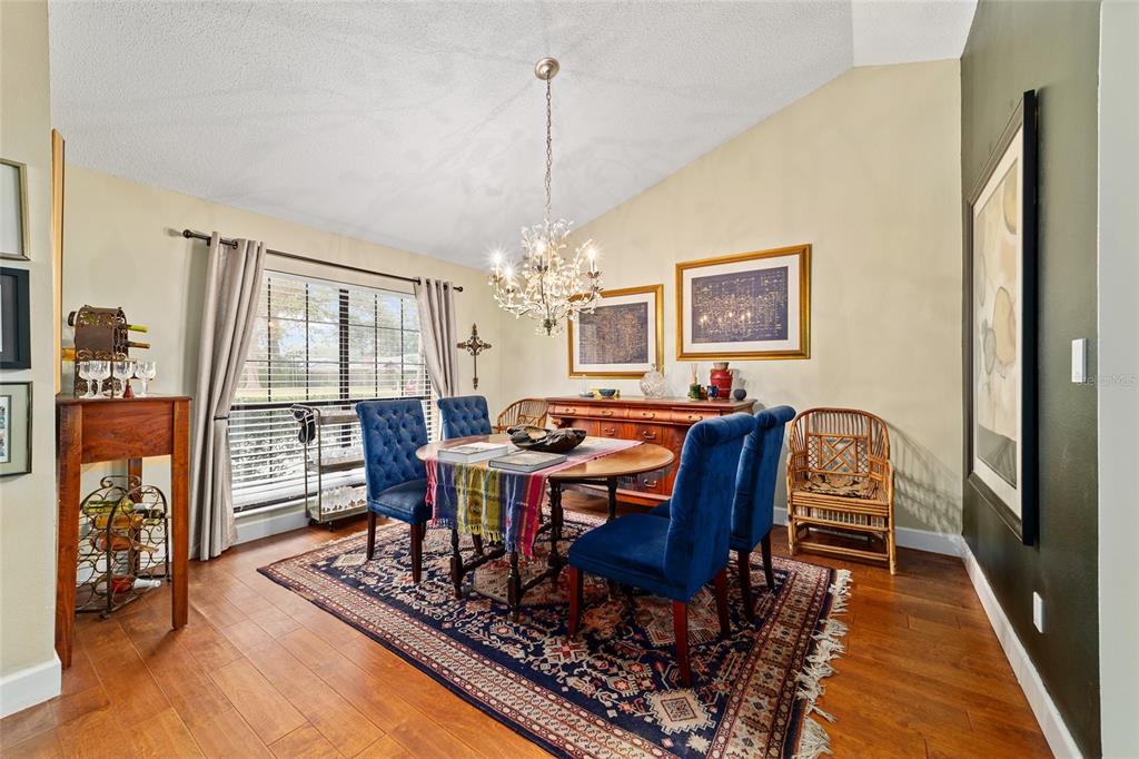 5030 Southeast 3rd Place Ocala, FL 34471 - Photo 7 of 45 a view of a dining room with furniture window and wooden floor