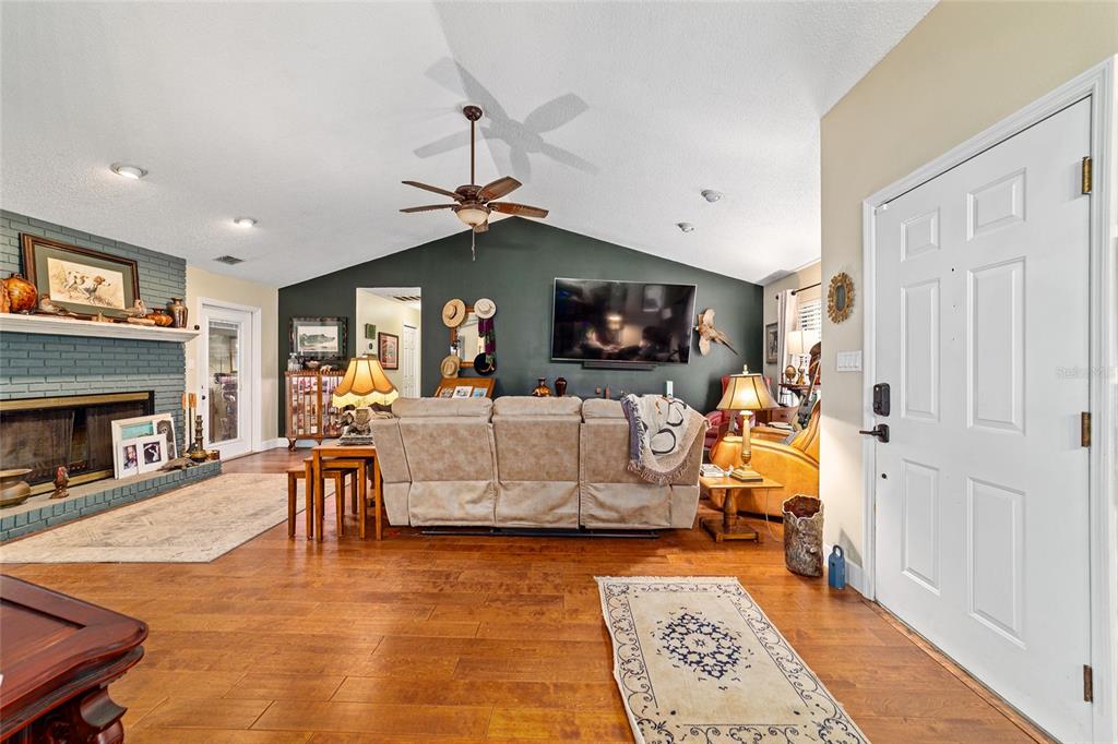 5030 Southeast 3rd Place Ocala, FL 34471 - Photo 10 of 45 a living room with furniture and a fireplace
