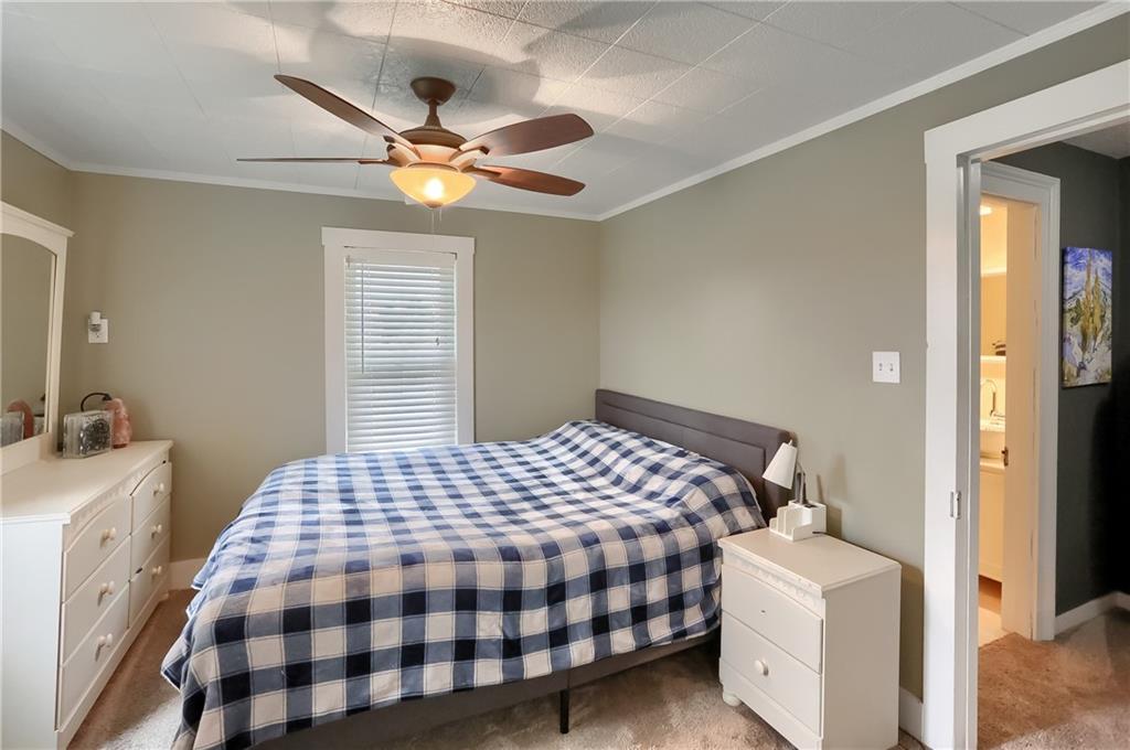 186 Tippecanoe Road Knox, PA 16232 - Photo 18 of 42 a bedroom with a bed and a chandelier