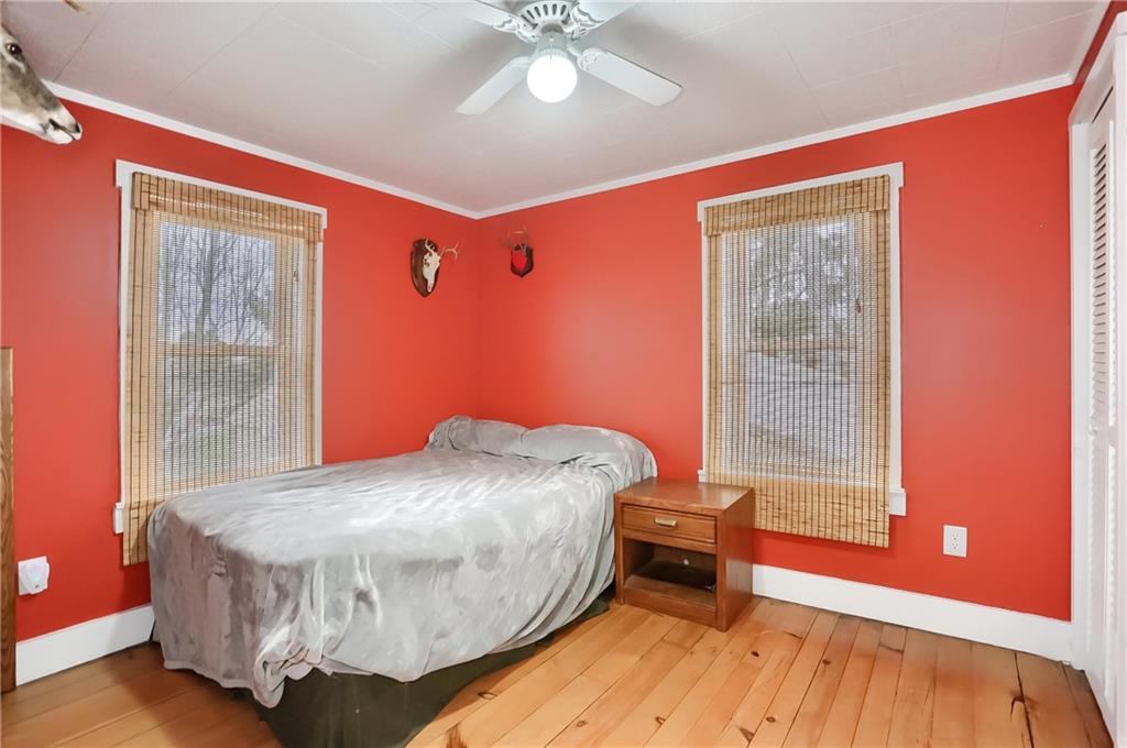 186 Tippecanoe Road Knox, PA 16232 - Photo 25 of 42 a bedroom with a bed and wooden floor