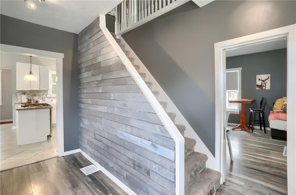 186 Tippecanoe Road Knox, PA 16232 - Photo 3 of 42 a view of a hallway with wooden floor and staircase
