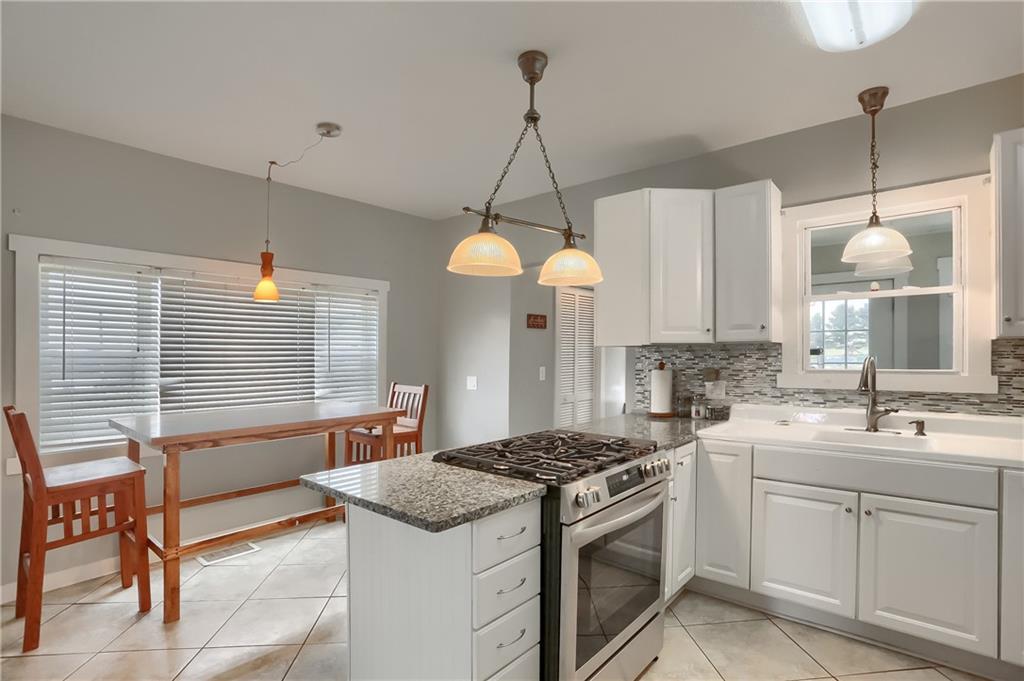 186 Tippecanoe Road Knox, PA 16232 - Photo 4 of 42 a kitchen with a sink stove and cabinets