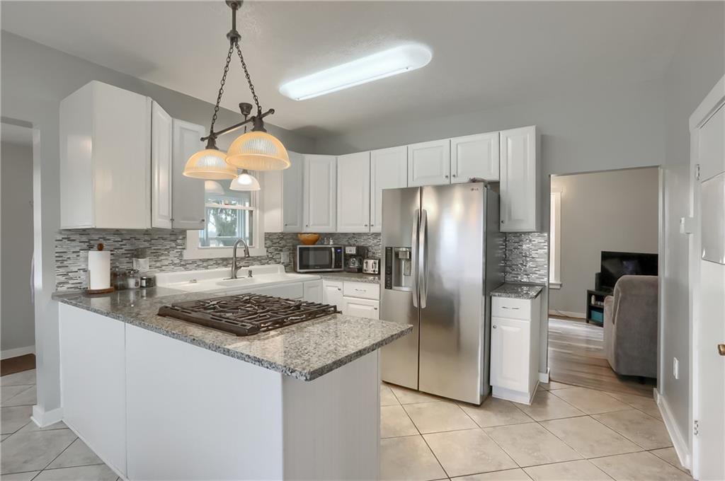 186 Tippecanoe Road Knox, PA 16232 - Photo 5 of 42 a kitchen with stainless steel appliances granite countertop a refrigerator a sink a stove and a refrigerator