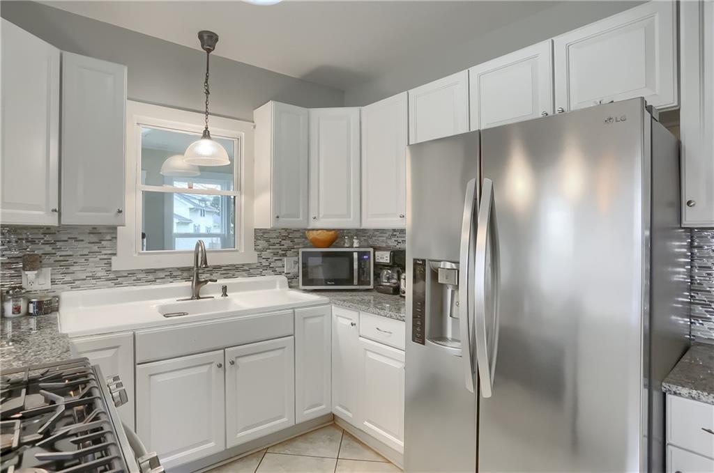 186 Tippecanoe Road Knox, PA 16232 - Photo 6 of 42 a kitchen with a sink stainless steel appliances and cabinets
