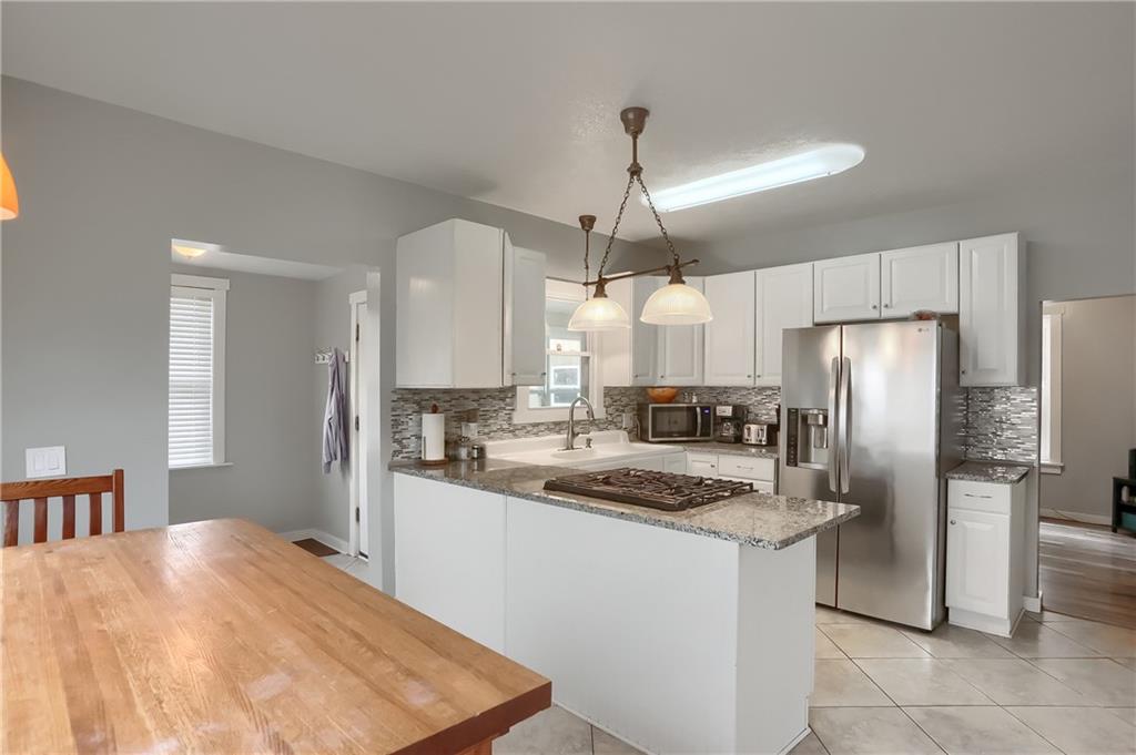 186 Tippecanoe Road Knox, PA 16232 - Photo 10 of 42 a kitchen with a refrigerator a sink and cabinets