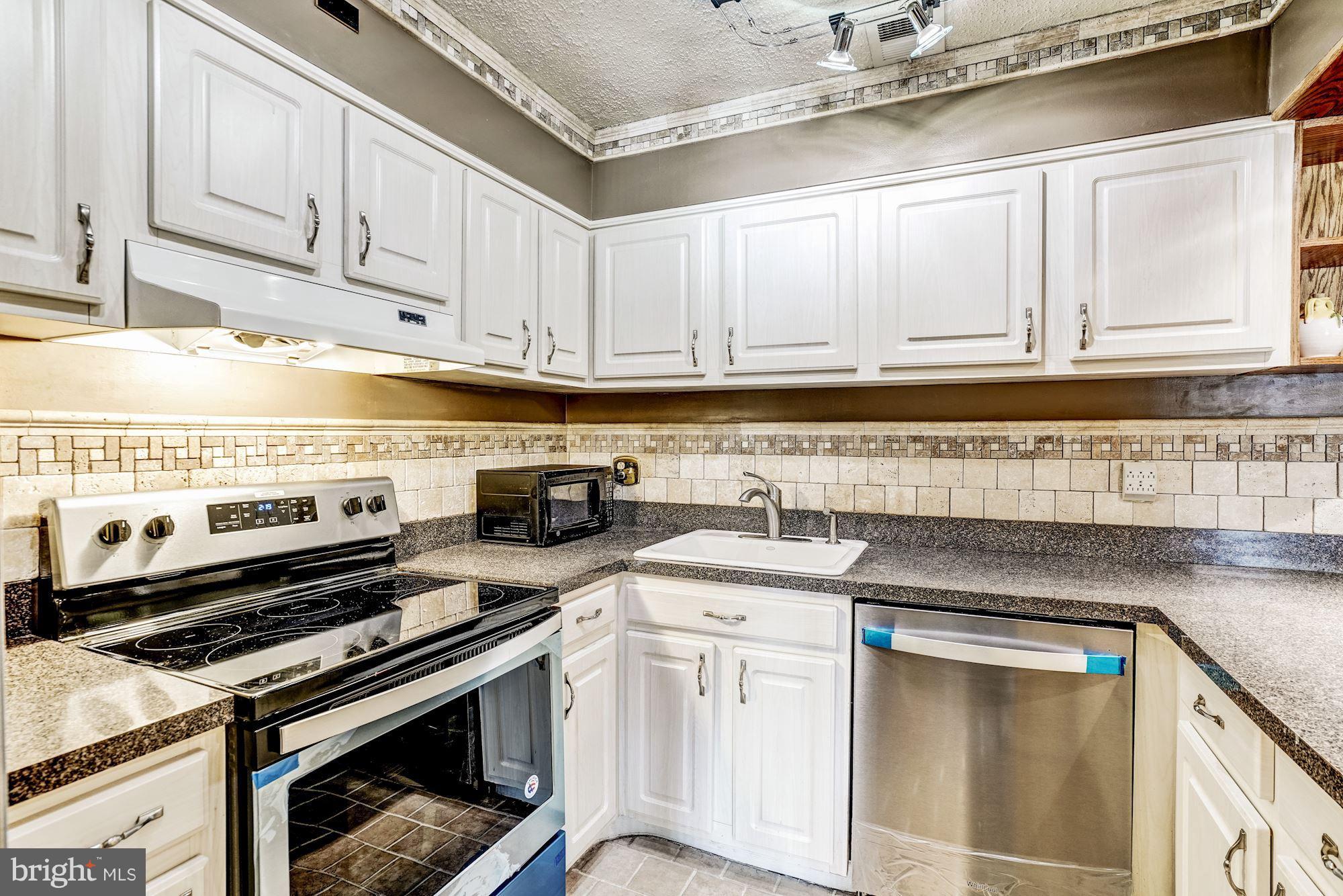 2254 Coppersmith Square Reston, VA 20191 - Photo 2 of 25 Kitchen with Stainless Steel Appliances