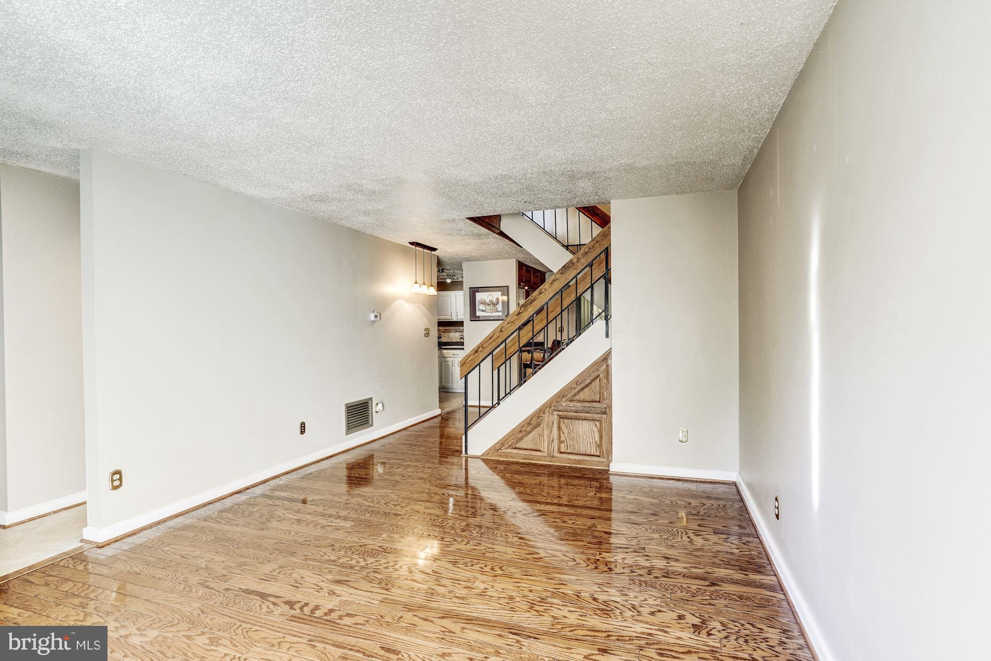 2254 Coppersmith Square Reston, VA 20191 - Photo 9 of 25 Hardwood Floors in Living Room
