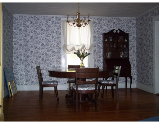 650 County Road Holyoke, MA 01040 - Photo 9 of 14 a dining room with furniture wooden floor a rug and a chandelier
