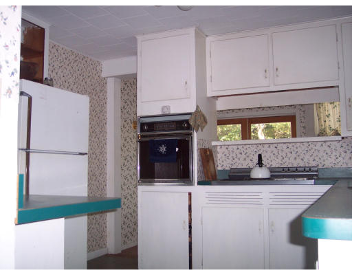 650 County Road Holyoke, MA 01040 - Photo 10 of 14 a kitchen with stainless steel appliances kitchen island granite countertop a refrigerator and a stove