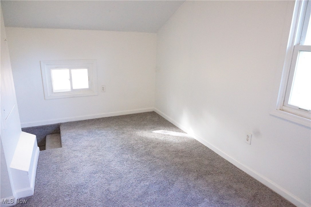 3276 Cottage Grove Road Akron, OH 44319 - Photo 10 of 18 Bedroom view 1 of 3. Stairs from living room to bedroom. featuring plenty of natural light