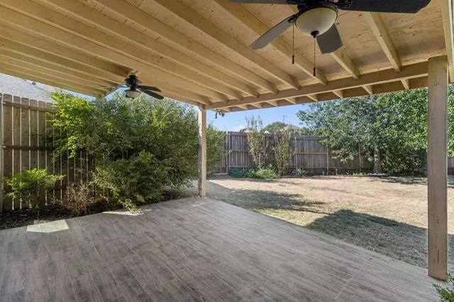 a view of a backyard of the house