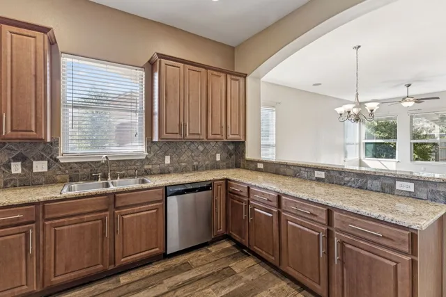a kitchen with a sink and cabinets