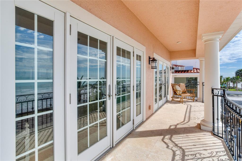 16116 Gulf Boulevard Redington Beach, FL 33708 - Photo 20 of 49 a view of a balcony with wooden floor and windows