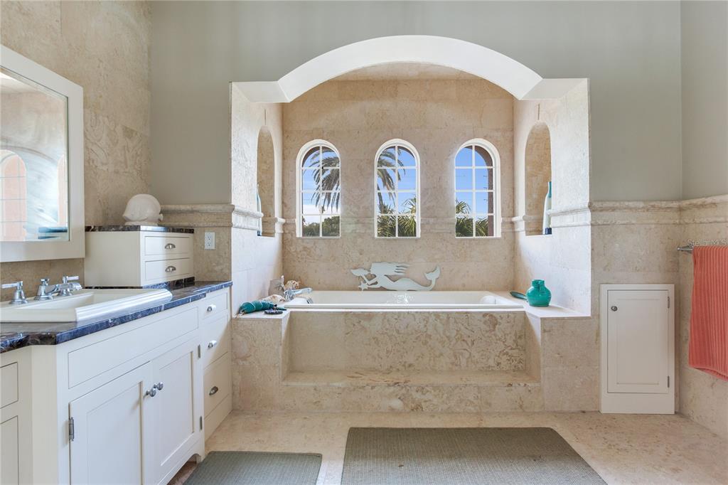 16116 Gulf Boulevard Redington Beach, FL 33708 - Photo 26 of 49 a bathroom with a sink and a mirror