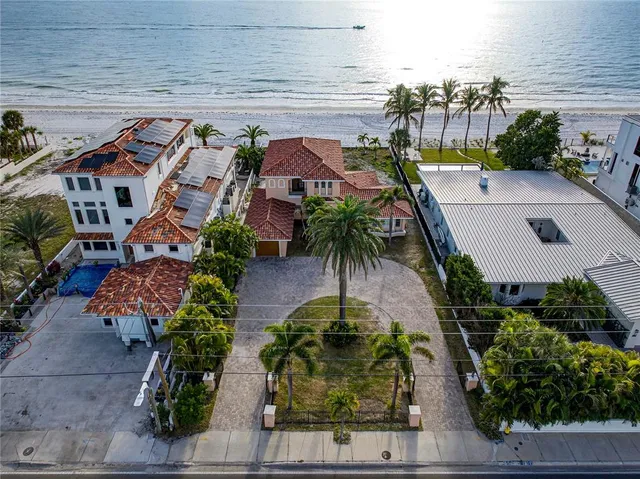 an aerial view of multiple houses with yard