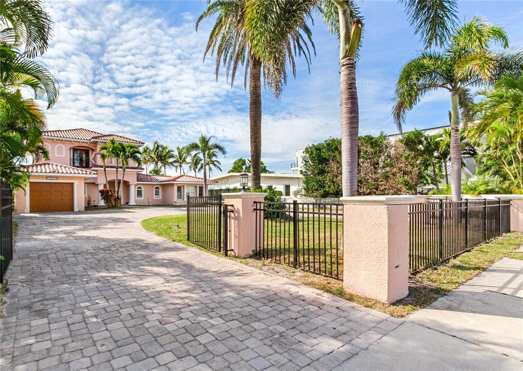 16116 Gulf Boulevard Redington Beach, FL 33708 - Photo 4 of 49 a view of a backyard with palm tree