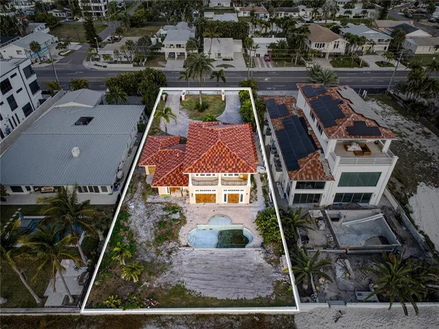 an aerial view of multiple houses with yard