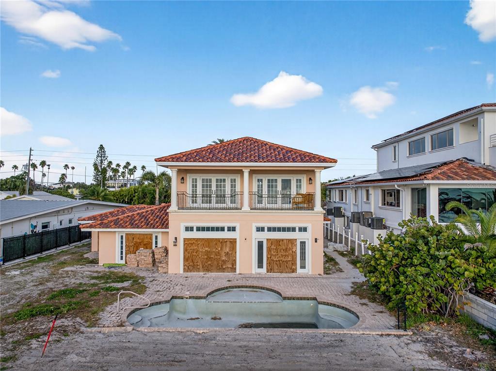16116 Gulf Boulevard Redington Beach, FL 33708 - Photo 46 of 49 a front view of a house with a yard