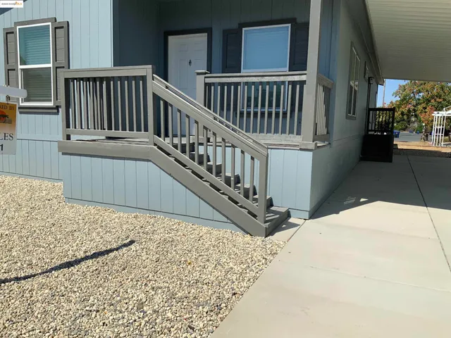 a view of balcony with wooden floor