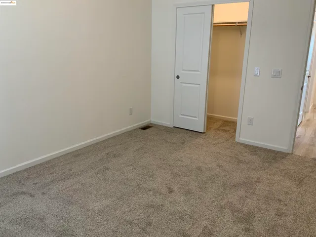 a bathroom with a sink a toilet and a window