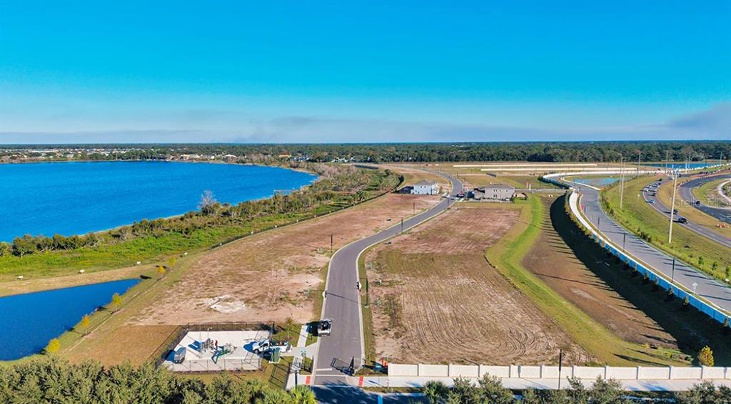 19285 Lochside Lane Mount Dora, FL 32757 - Photo 7 of 13 an aerial view of a house with a ocean view