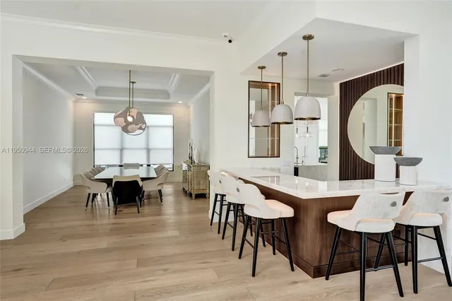 a dinning table and chairs in a kitchen