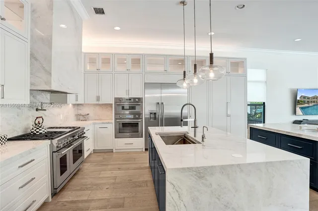 a white stove top oven sitting inside of a kitchen