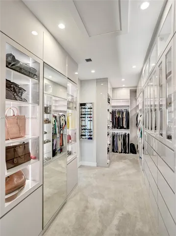 a large bathroom with a large tub and sink