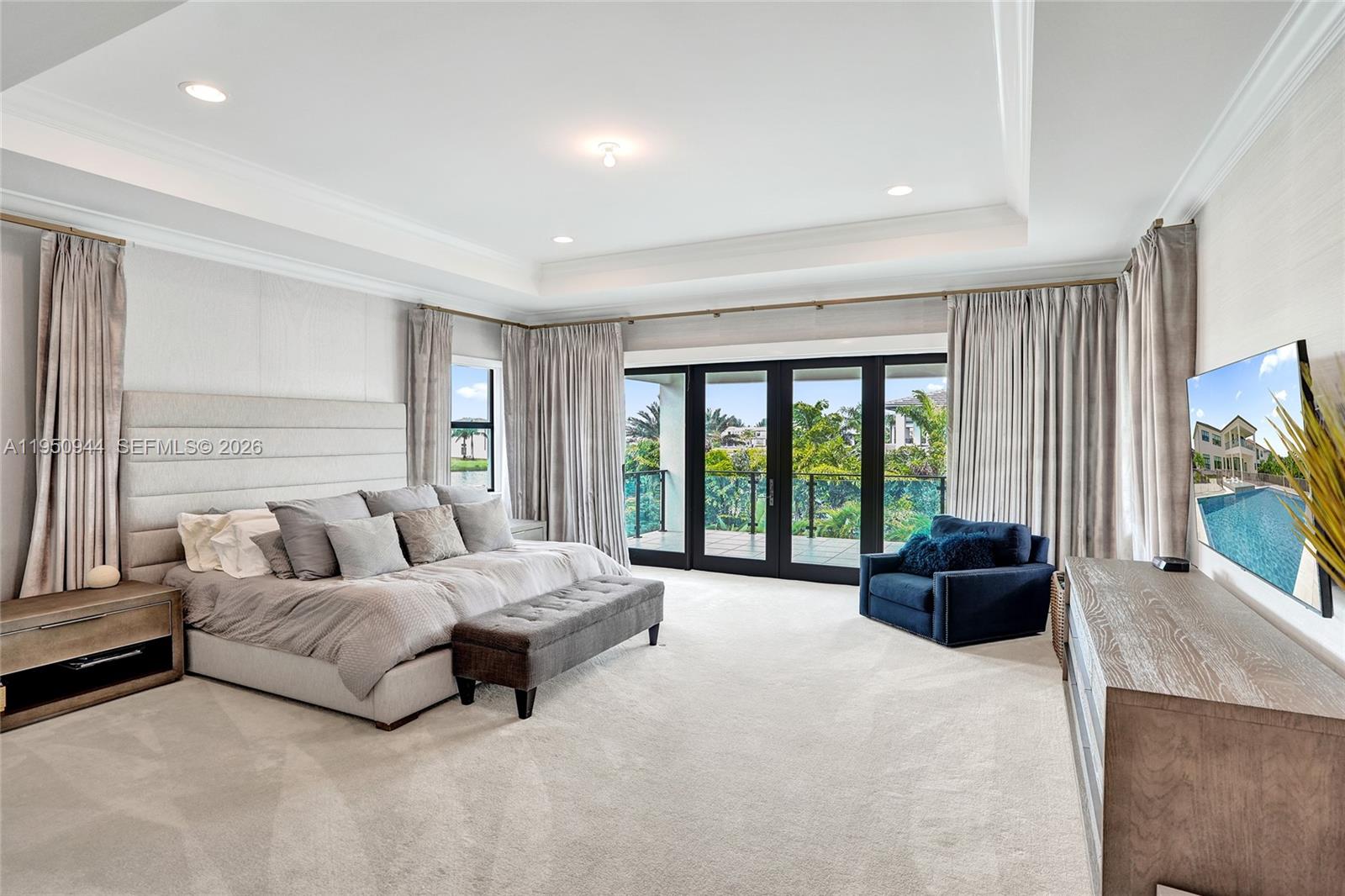17385 Ponte Chiasso Drive Boca Raton, FL 33496 - Photo 37 of 38 a living room with furniture and a flat screen tv