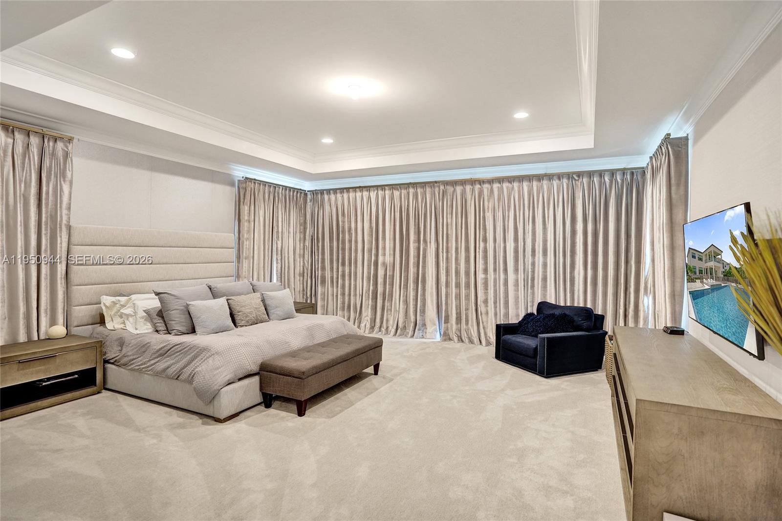 17385 Ponte Chiasso Drive Boca Raton, FL 33496 - Photo 38 of 38 a living room with furniture and a flat screen tv