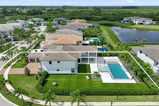 an aerial view of a house with a garden