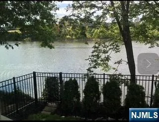 a view of swimming pool from a lake