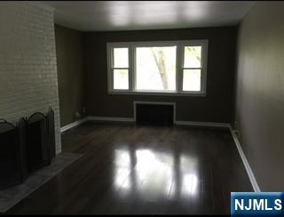 506 Riverside Avenue Rutherford, NJ 07070 - Photo 7 of 12 wooden floor in a hall with a window