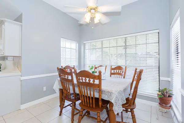 a view of a dining room with furniture window and outside view
