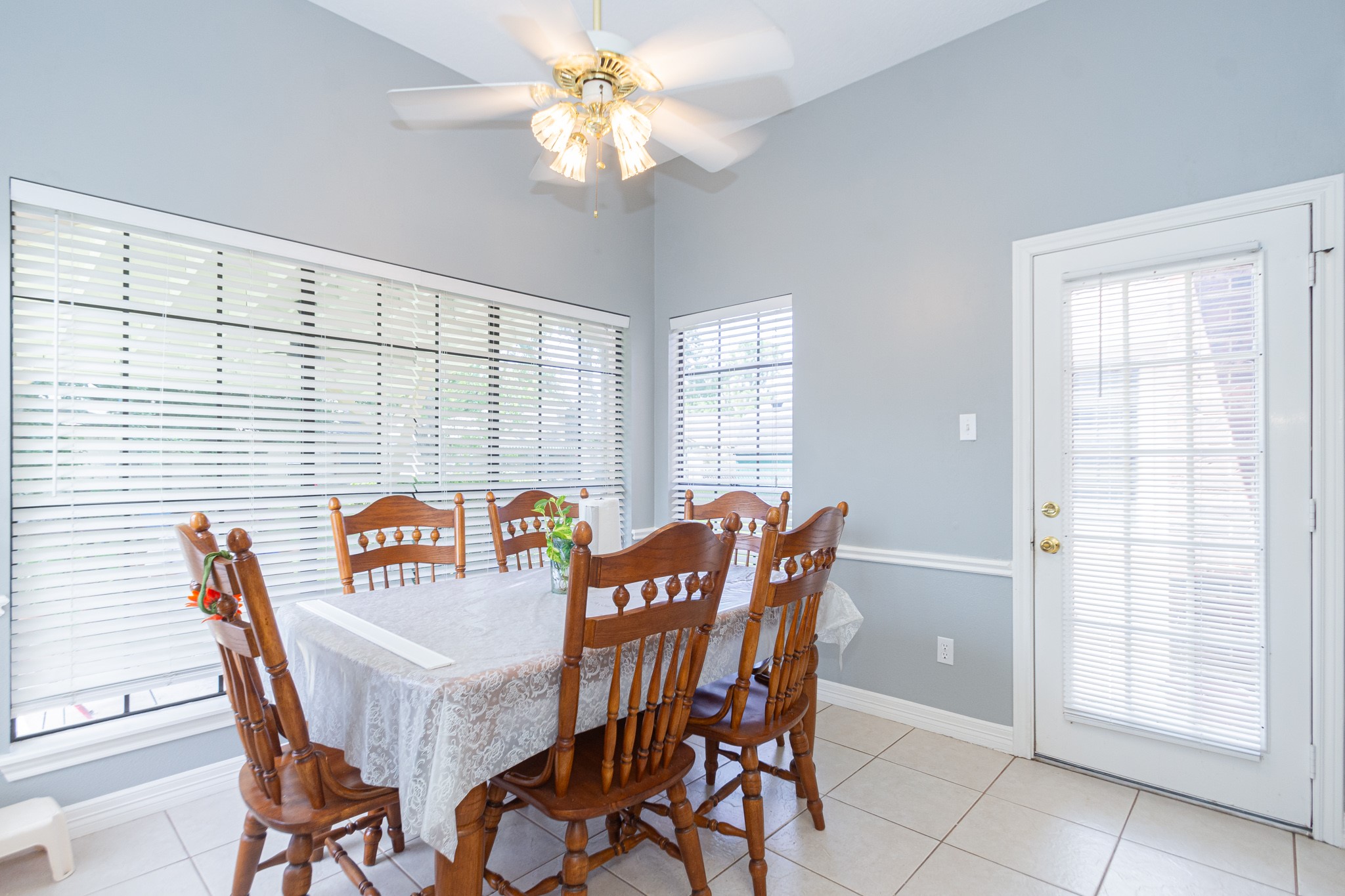 808 Manor Drive Angleton, TX 77515 - Photo 12 of 31 a view of a dining room with furniture and chandelier