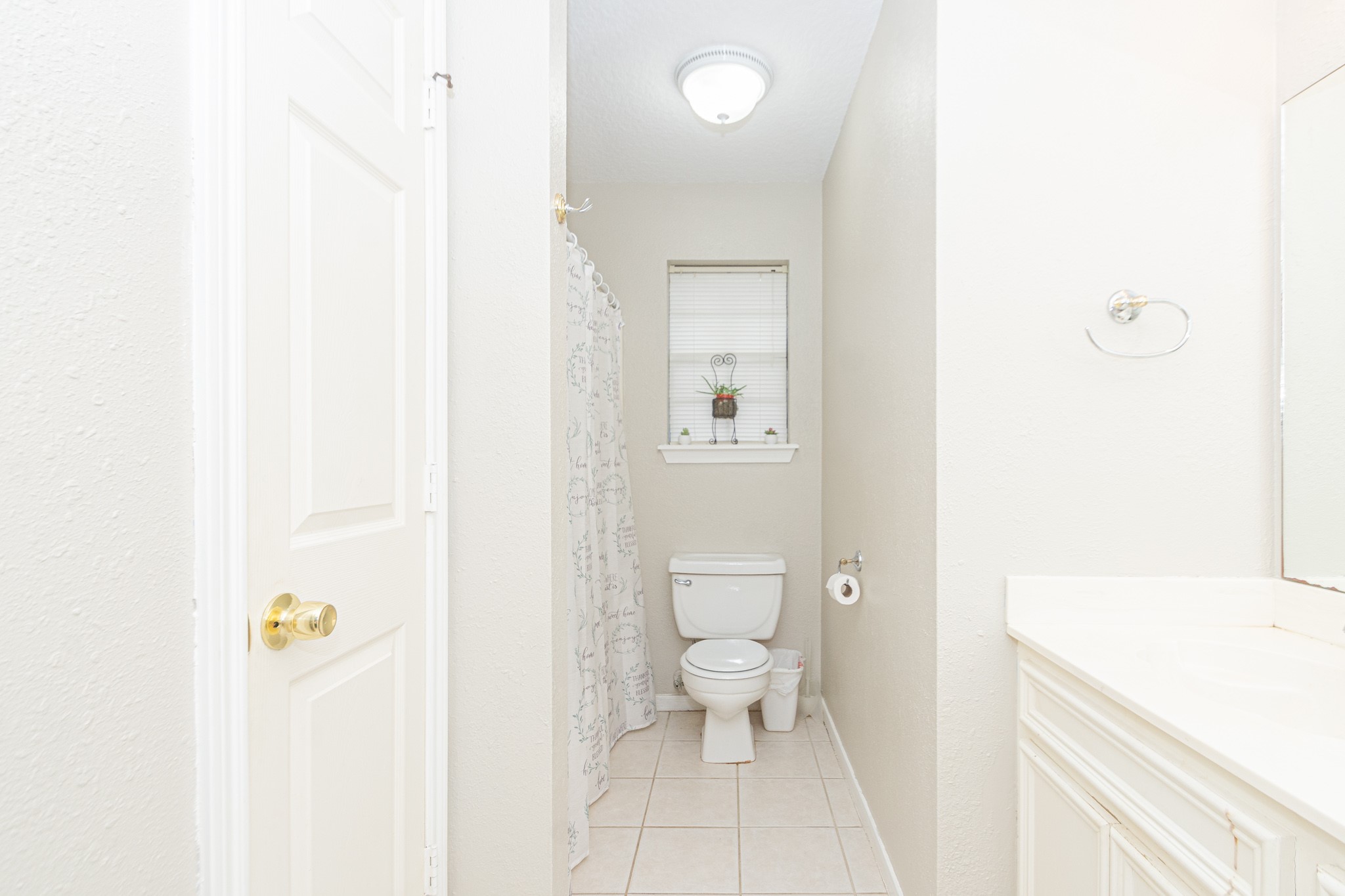 808 Manor Drive Angleton, TX 77515 - Photo 16 of 31 a bathroom with a sink a toilet and a shower