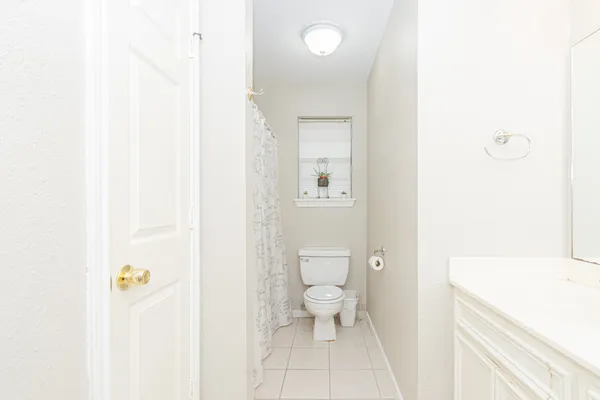 a bathroom with a sink a toilet and a shower