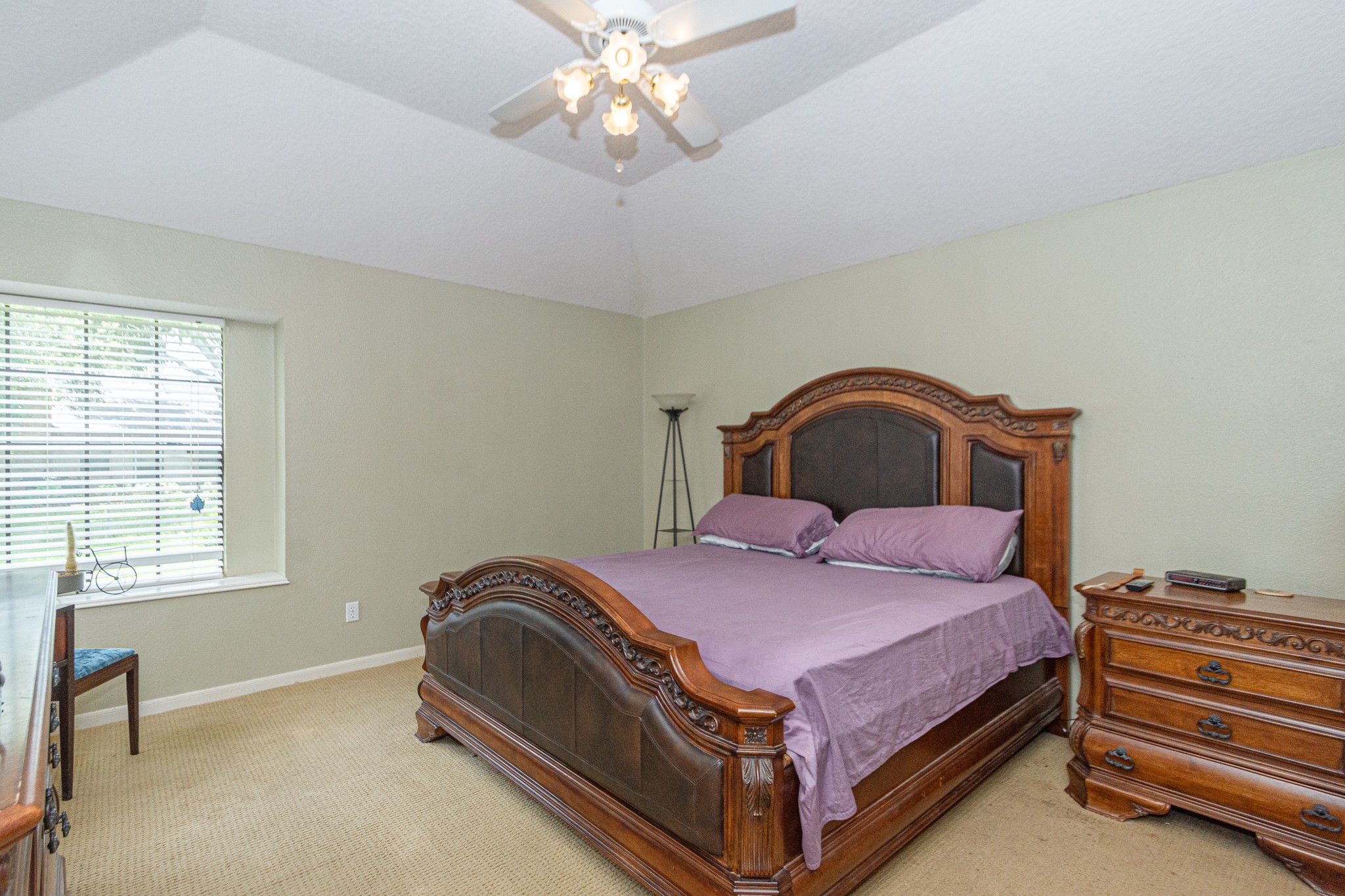 808 Manor Drive Angleton, TX 77515 - Photo 19 of 31 a bedroom with a bed and a window